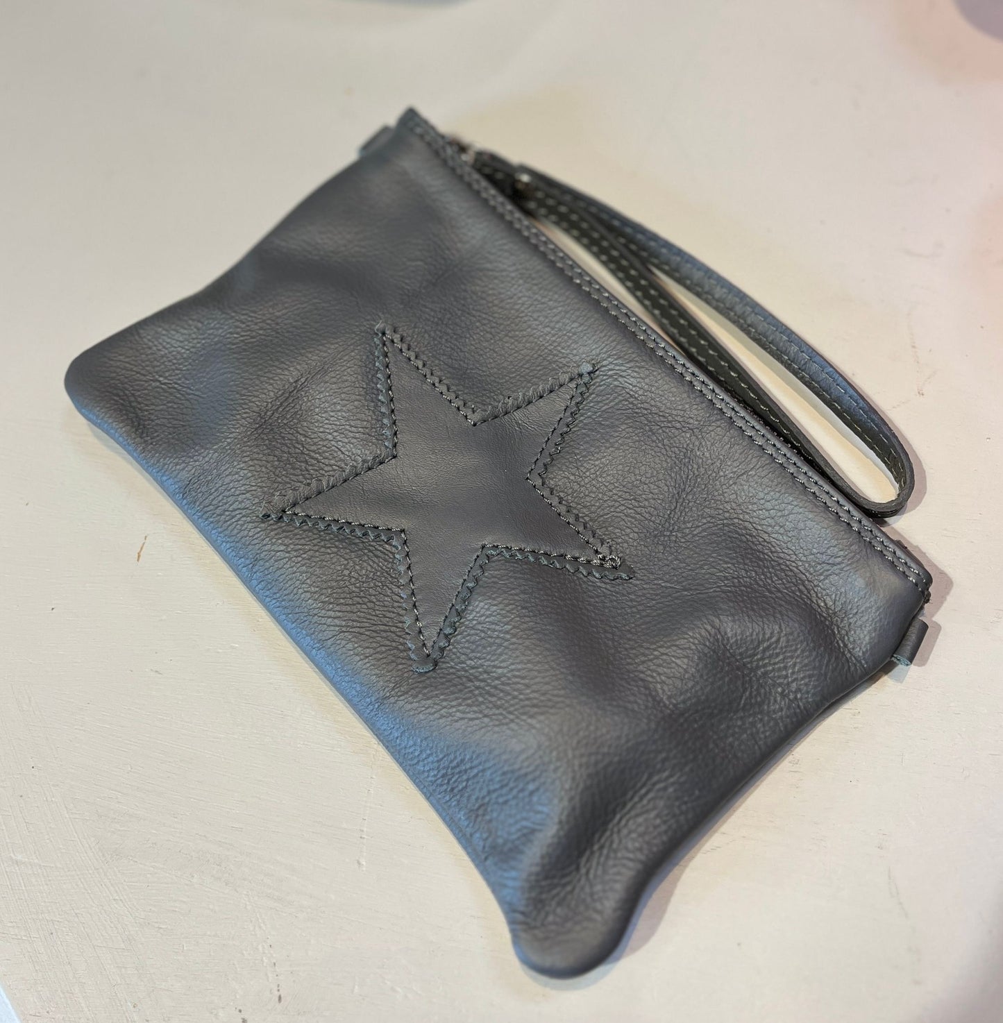 Leather star clutch bag